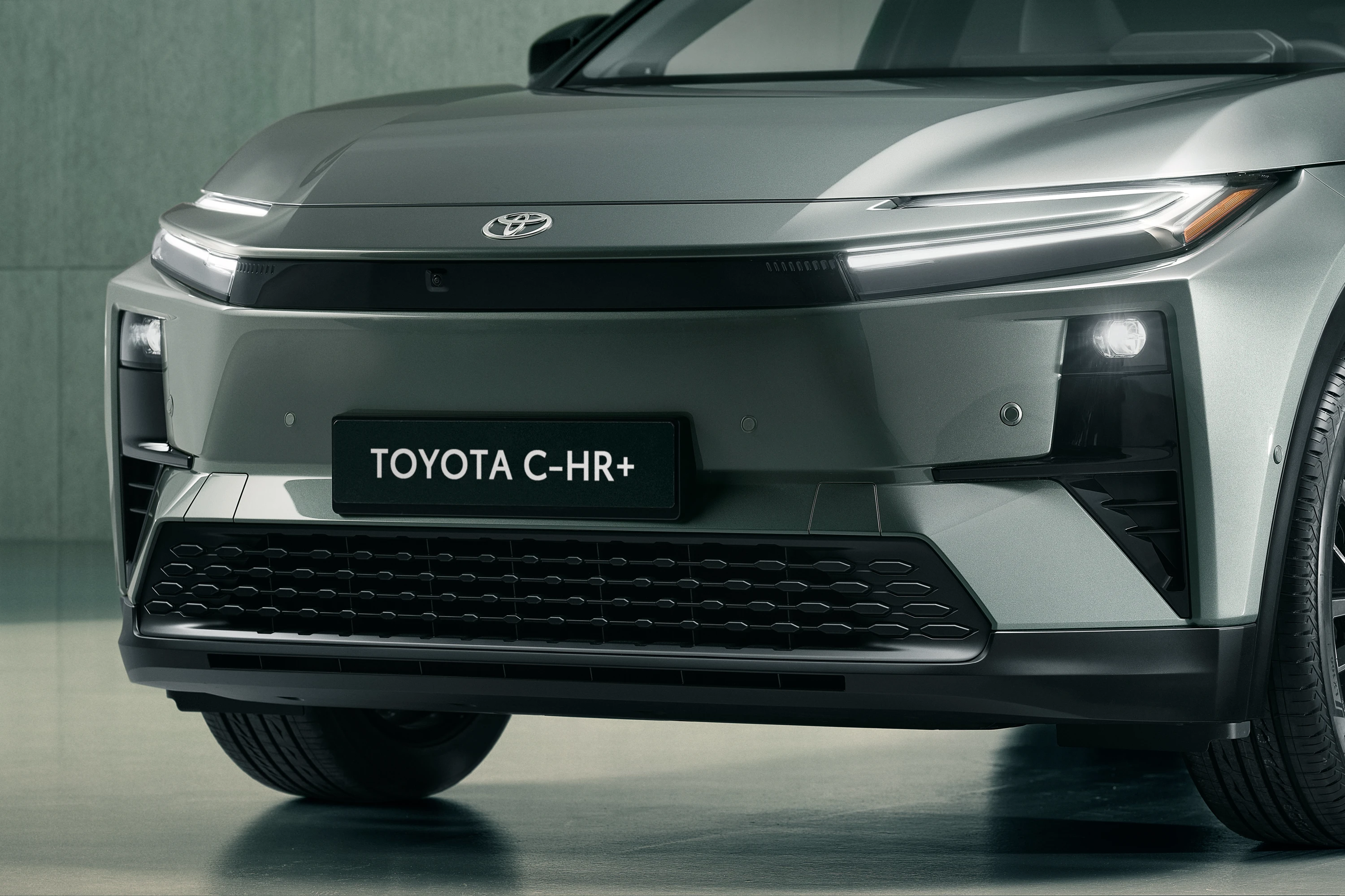 Toyota C-HR+ 57.7 kWh headlights view